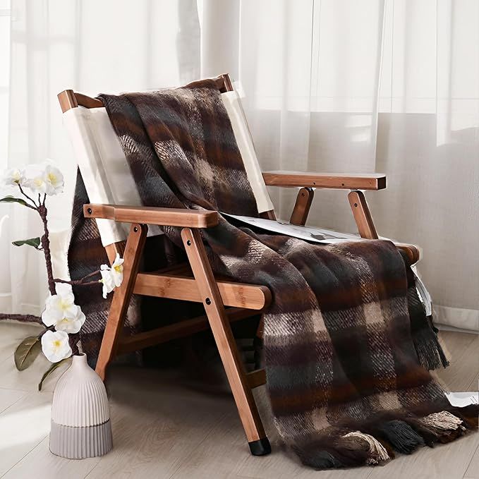 Brown plaid blanket on wood chair