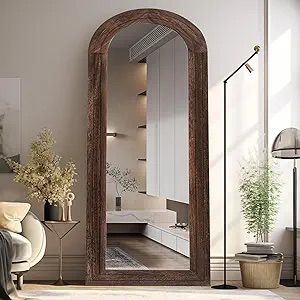 Arched floor mirror with dark wood frame