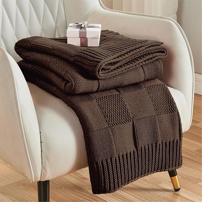 Checkered knit throw blanket on white chair