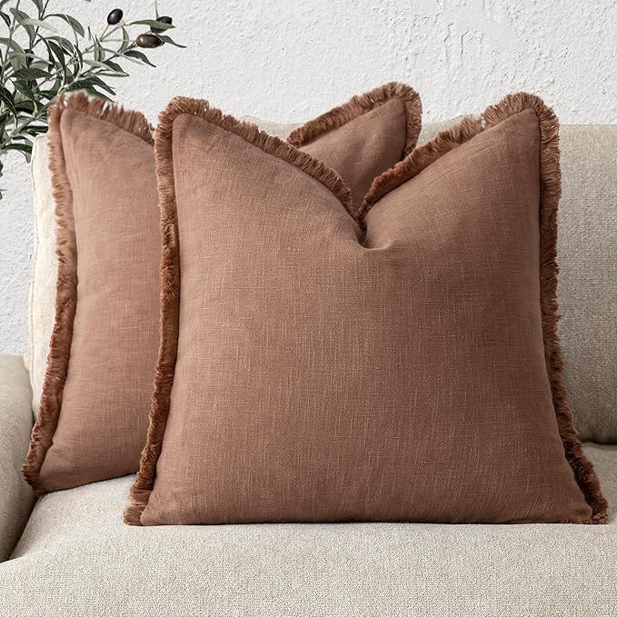 Rust colored pillows with fringe